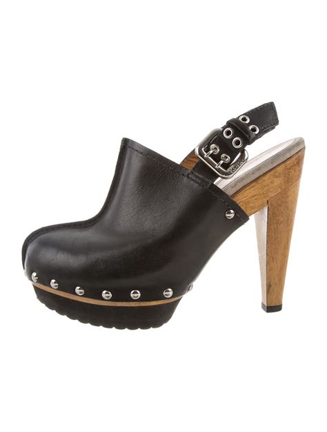 black studded michael kors clogs.